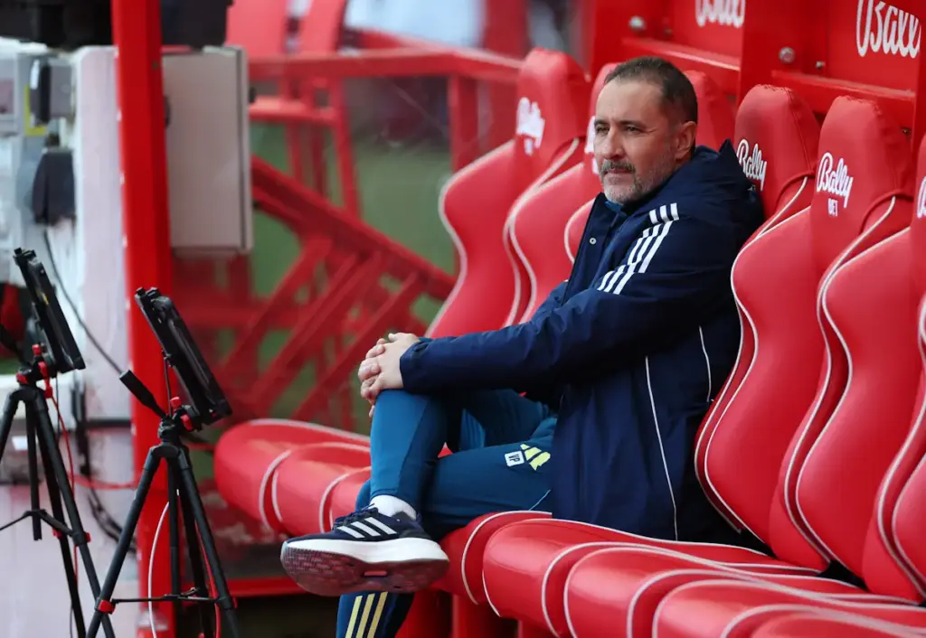 Nottingham Forest manager Vitor Pereira sits alone in the dugout on a red seat