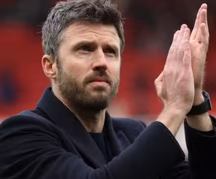 Manchester United manager Michael Carrick applauds the supporters