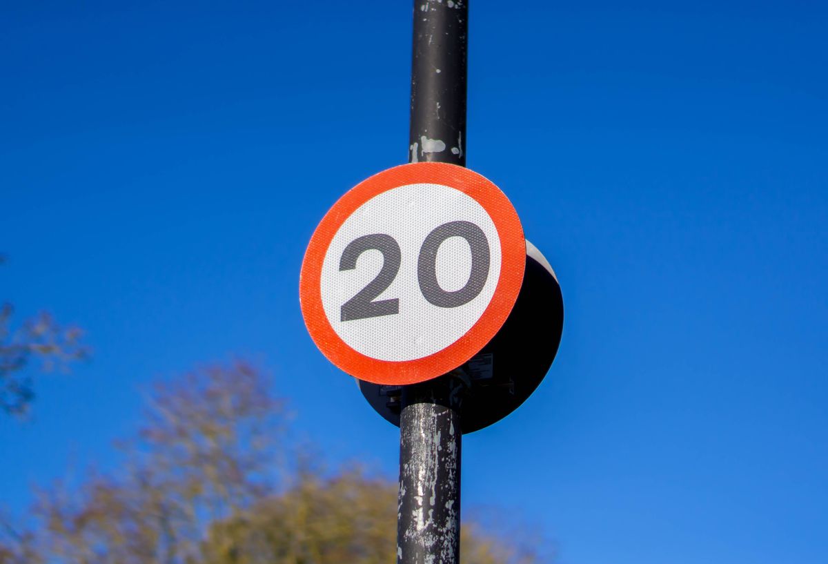 Saffron Walden, Essex, UK - January 15, 2024: 20mph speed limit sign against a blue sky