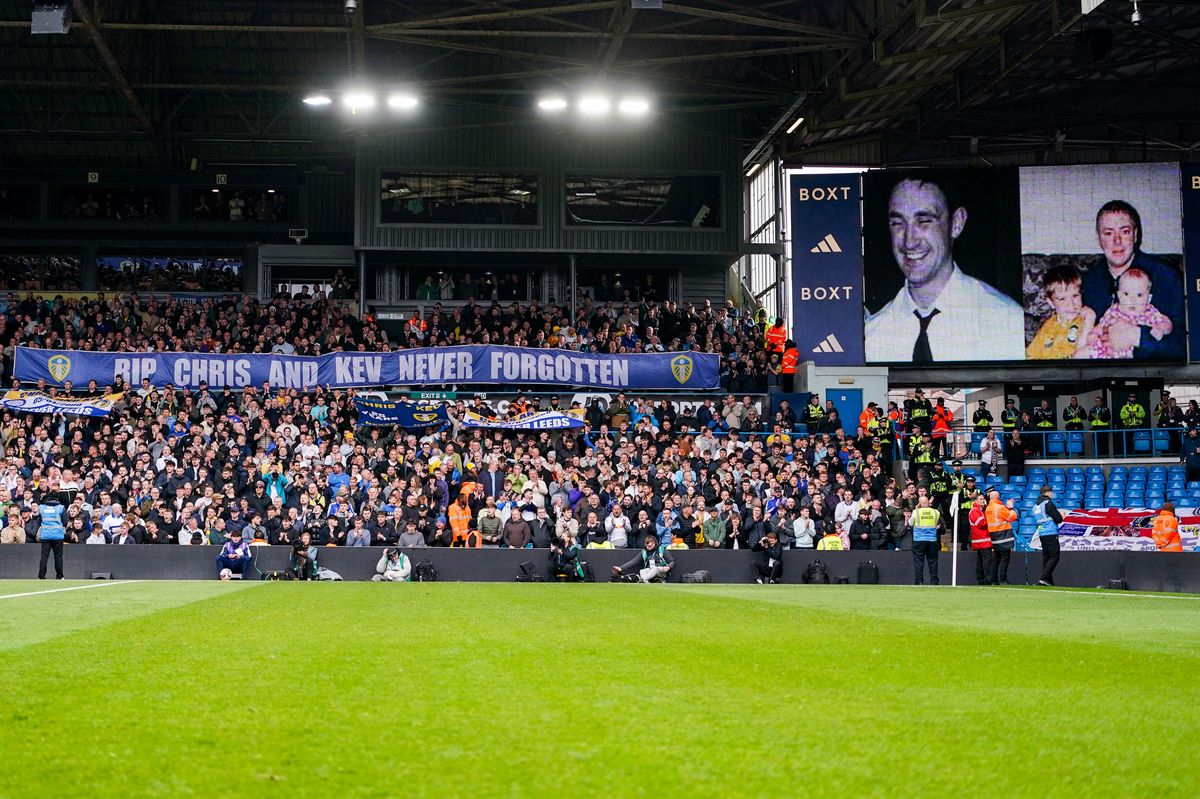 Leeds United fans hold up banners in tribute to Christopher Loftus and Kevin Speight