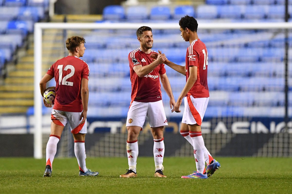 Amir Ibragimov, Tommy Rowe and Noah Ajayi of Manchester United celebrate