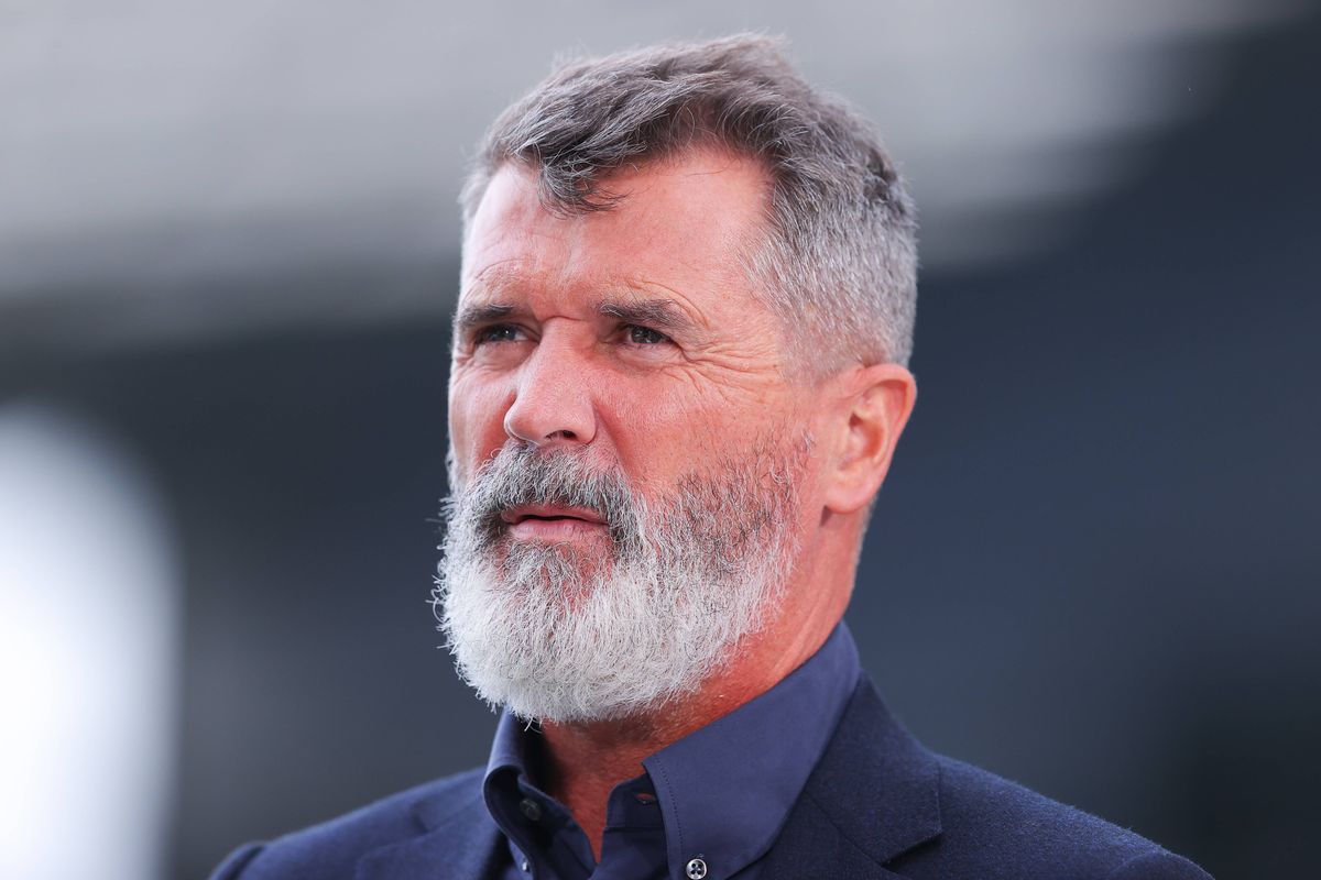 Roy Keane looks up squinting