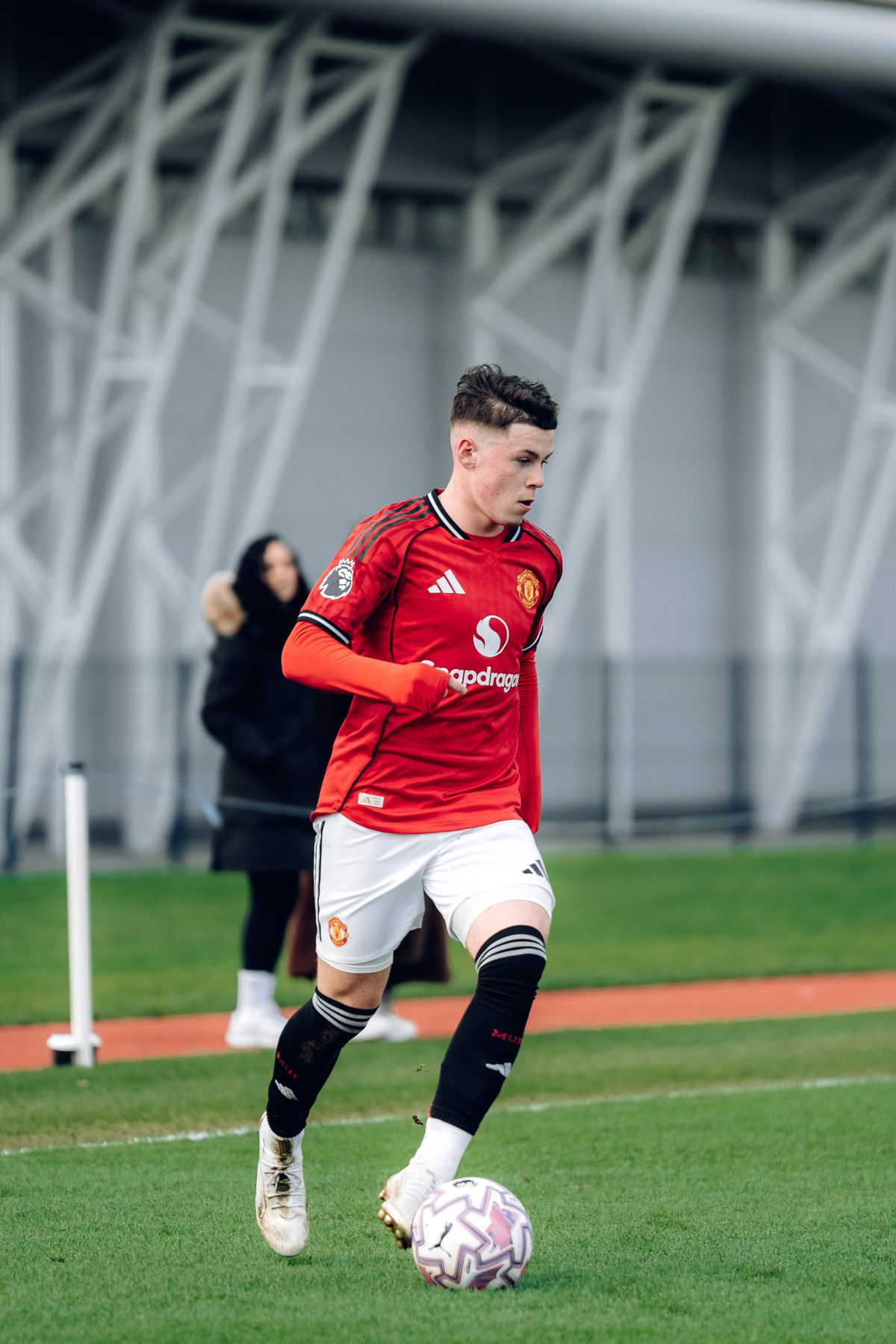 Kai Rooney on the ball for Man Utd