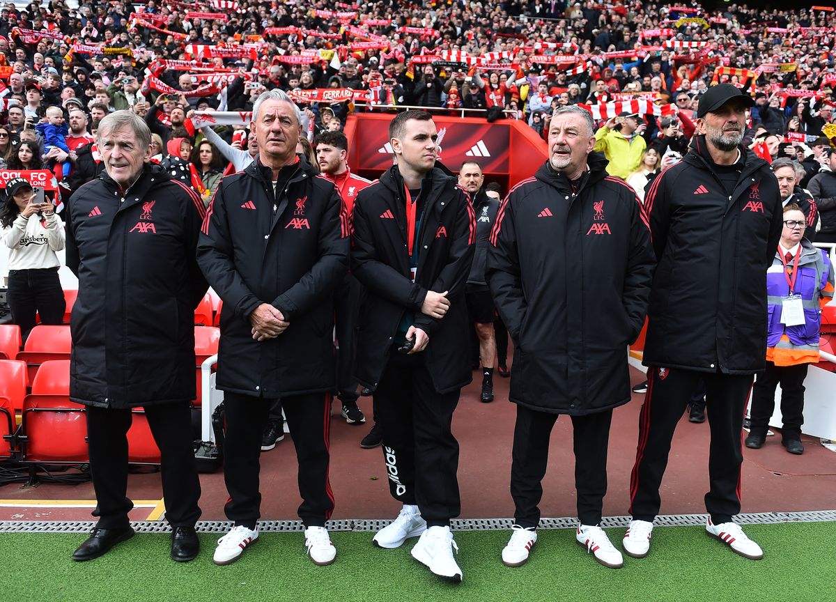 Sir Kenny Dalglish and his coaching staff ahead of kick-off at Anfield
