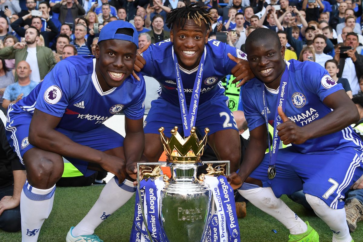 Kurt Zouma of Chelsea, Michy Batshuayi of Chelsea and N'Golo Kante of Chelsea pose with the Preimer League Trophy after the Premier League match between Chelsea and Sunderland