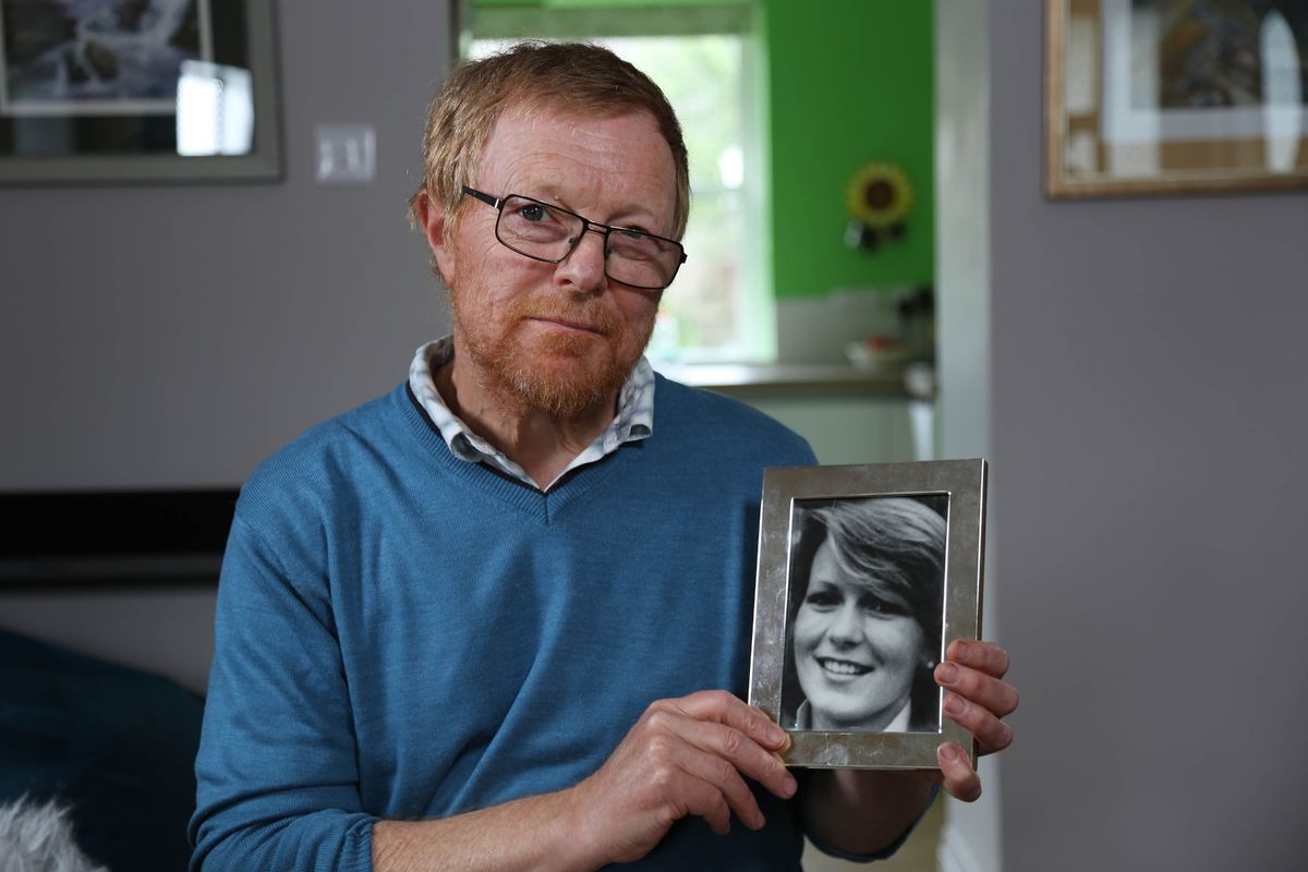 Richard Lamplugh holding a picture of his sister