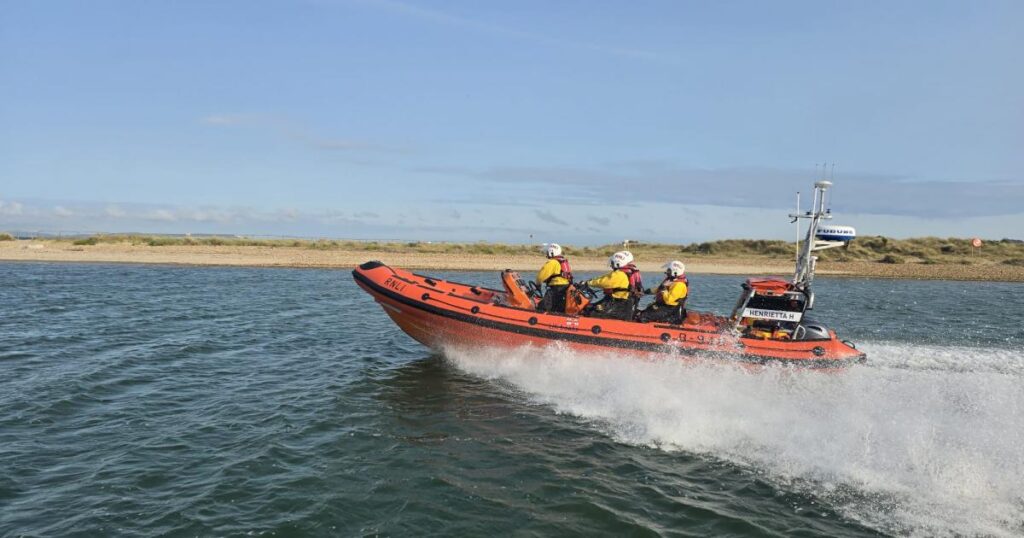Lifeboat assists broken-down jetskiers by Mudeford beach