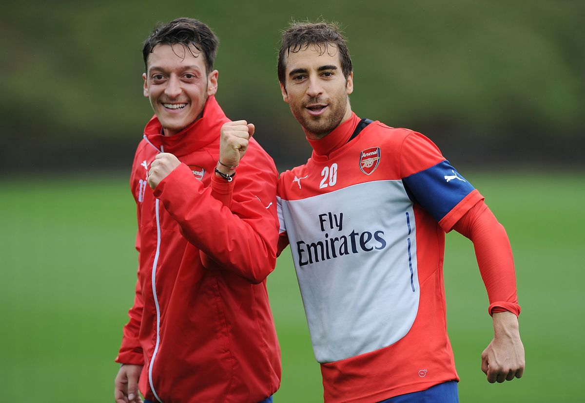 Mesut Ozil and Mathieu Flamini at Arsenal