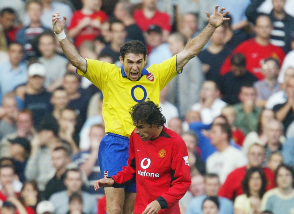 Martin Keown jumps above Ruud Van Nistlerooy during the infamous Old Trafford clash