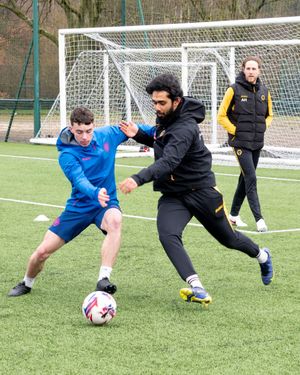Student Archie Grogan, 16, training with coaching staff member Vai Ramesh, watched by Asa Hall
