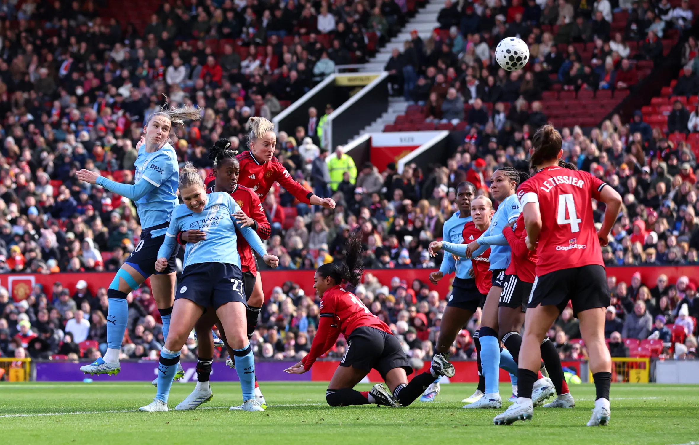 Manchester City's Vivianne Miedema scores a goal against Manchester United in a Women's Super League match.