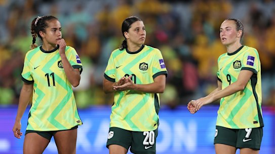 Mary Fowler, Sam Kerr and Caitlin Foord process the 3-3 draw.