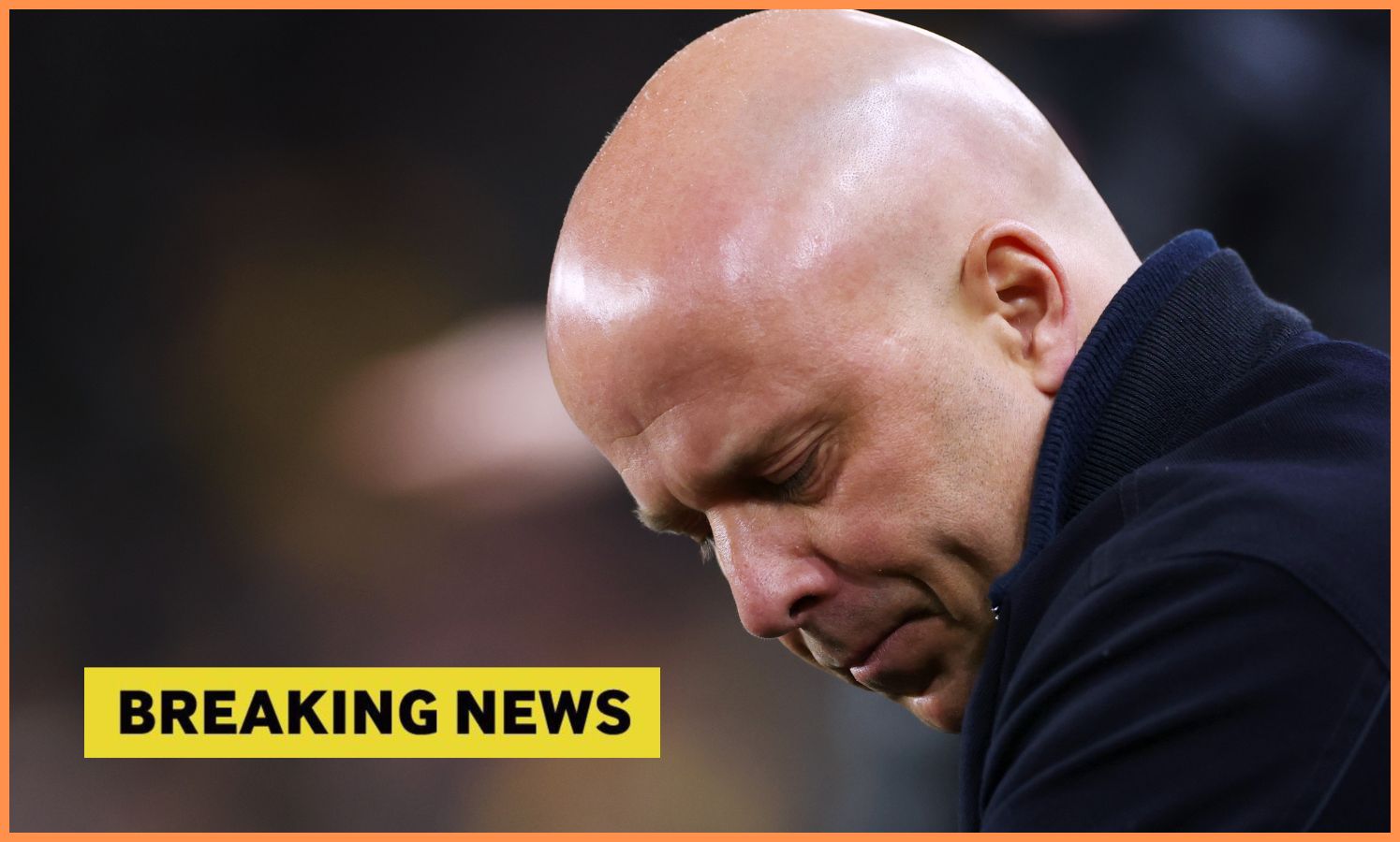 Liverpool manager Arne Slot looks on, plus 'breaking news' banner