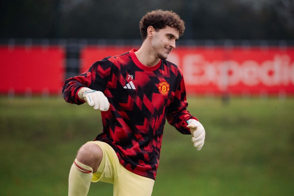 Cameron Byrne-Hughes warms up for Manchester United.
