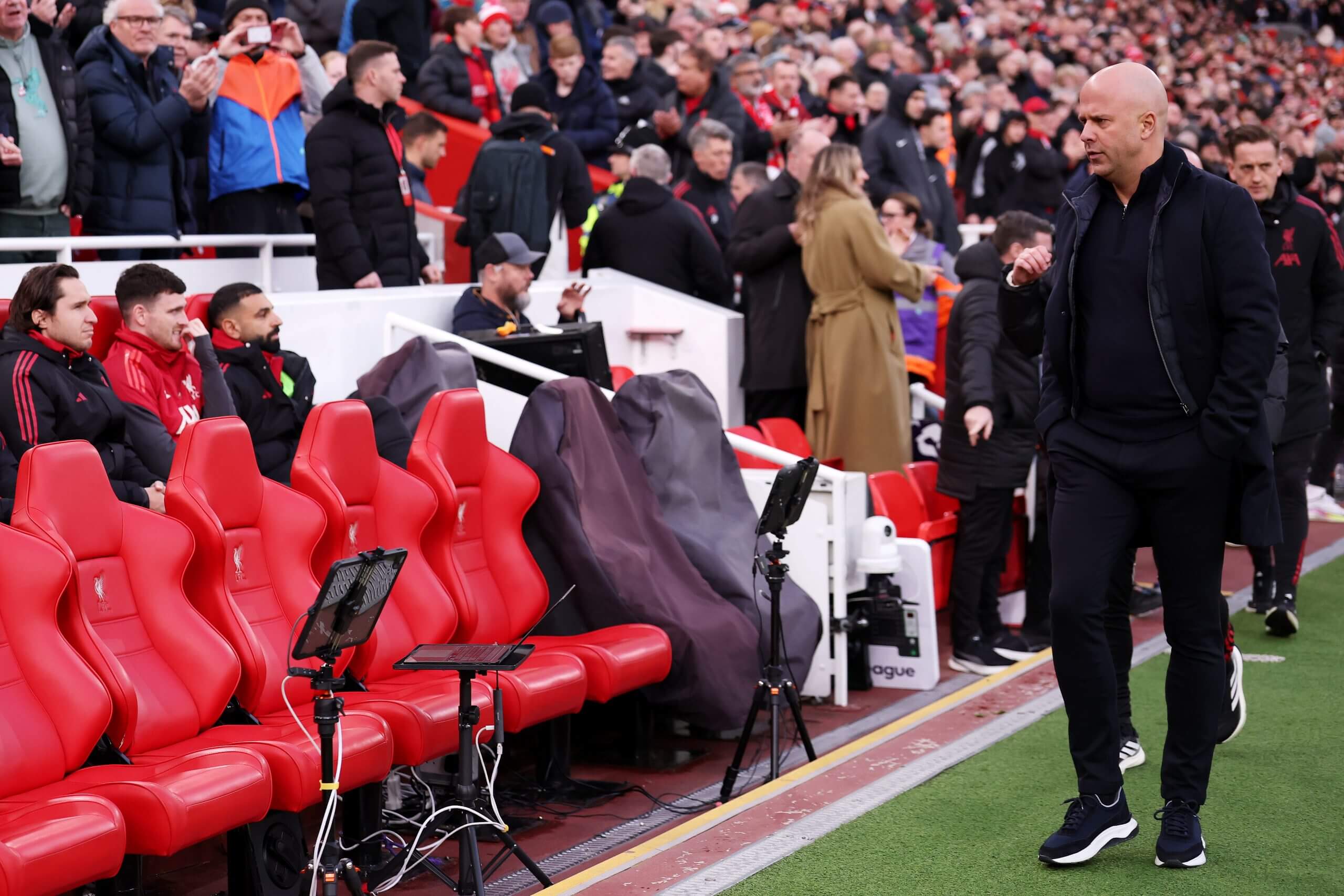 Liverpool manager Arne Slot walks past the substitutes’ bench during the Premier League match against Brighton