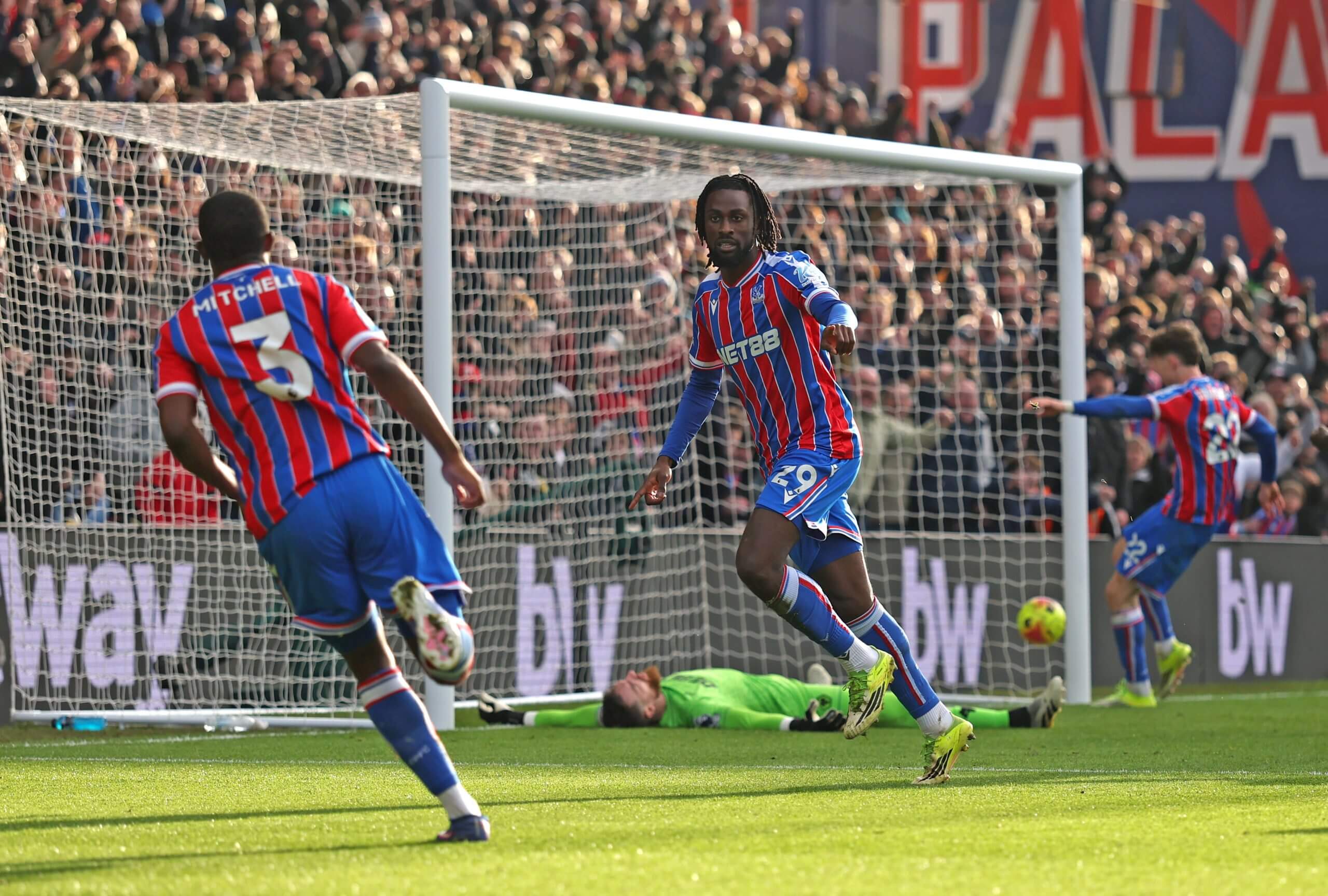 Evann Guessand wheels away in celebration after scoring the late winner against Wolves