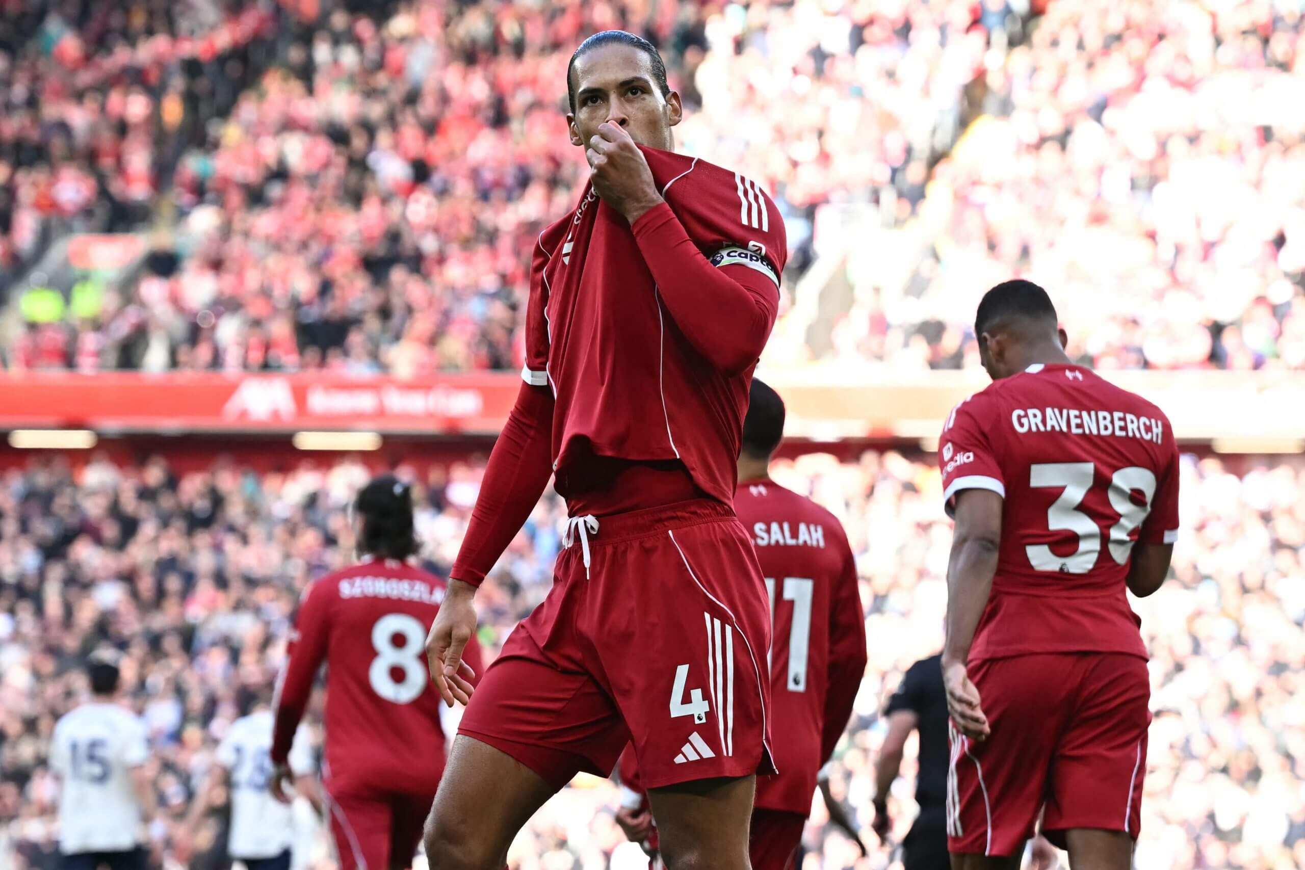Virgil van Dijk kisses the badge on his shirt after scoring his side's second goal against West Ham