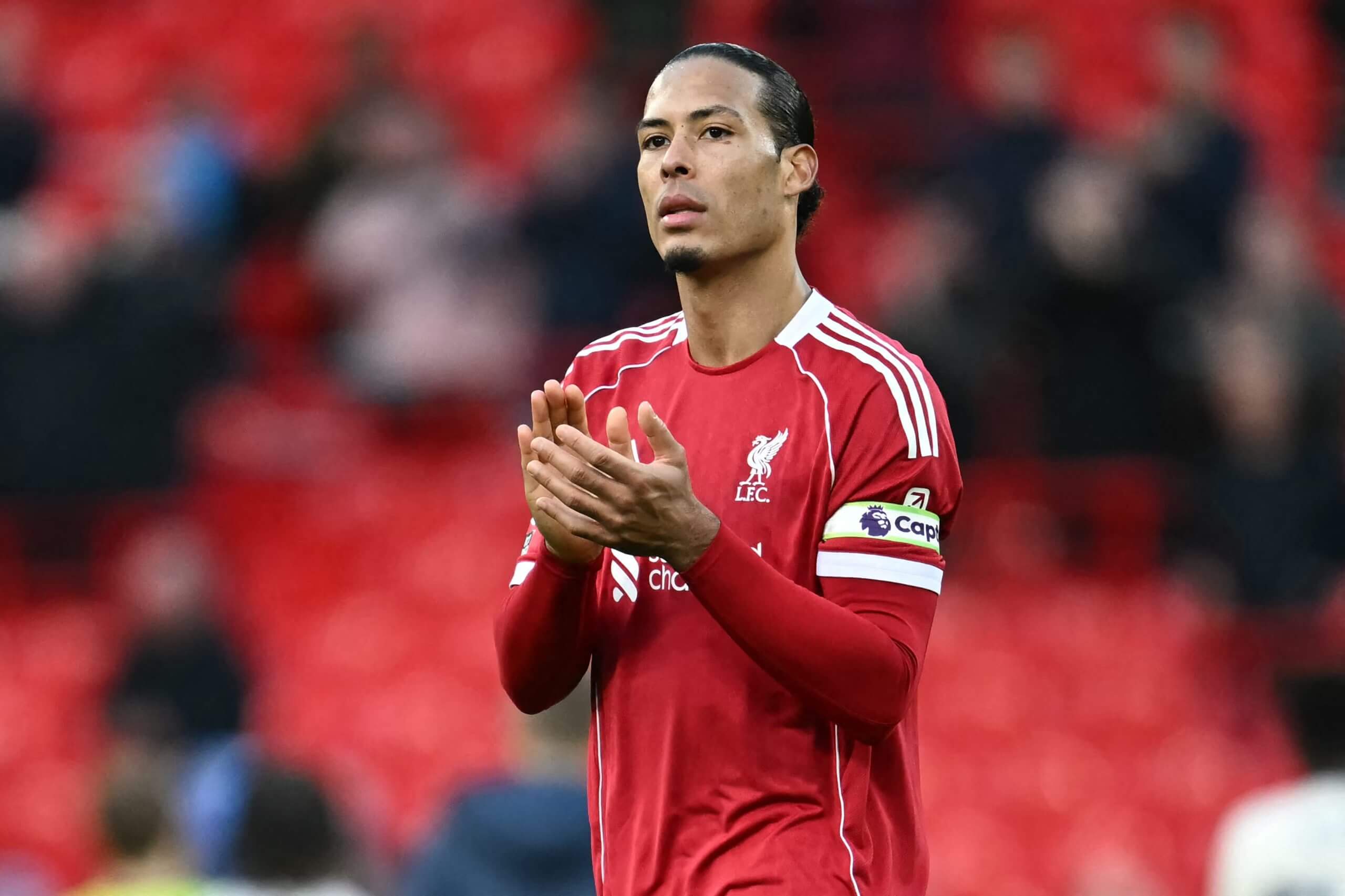 Virgil van Dijk applauds the Anfield crowd