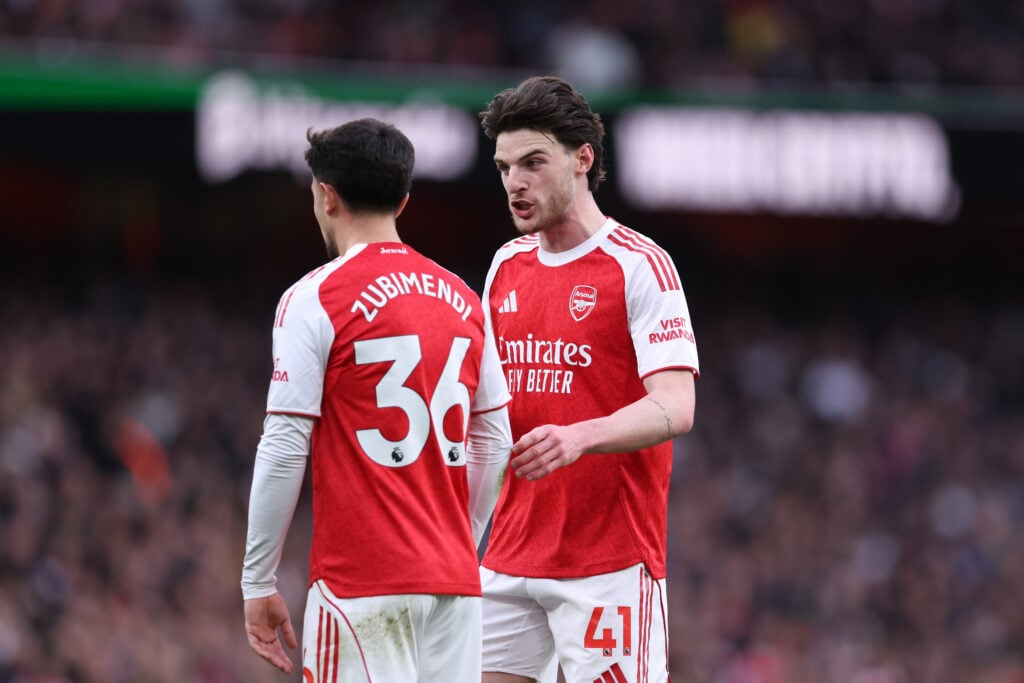 Declan Rice and Martin Zubimendi speaking during an Arsenal game
