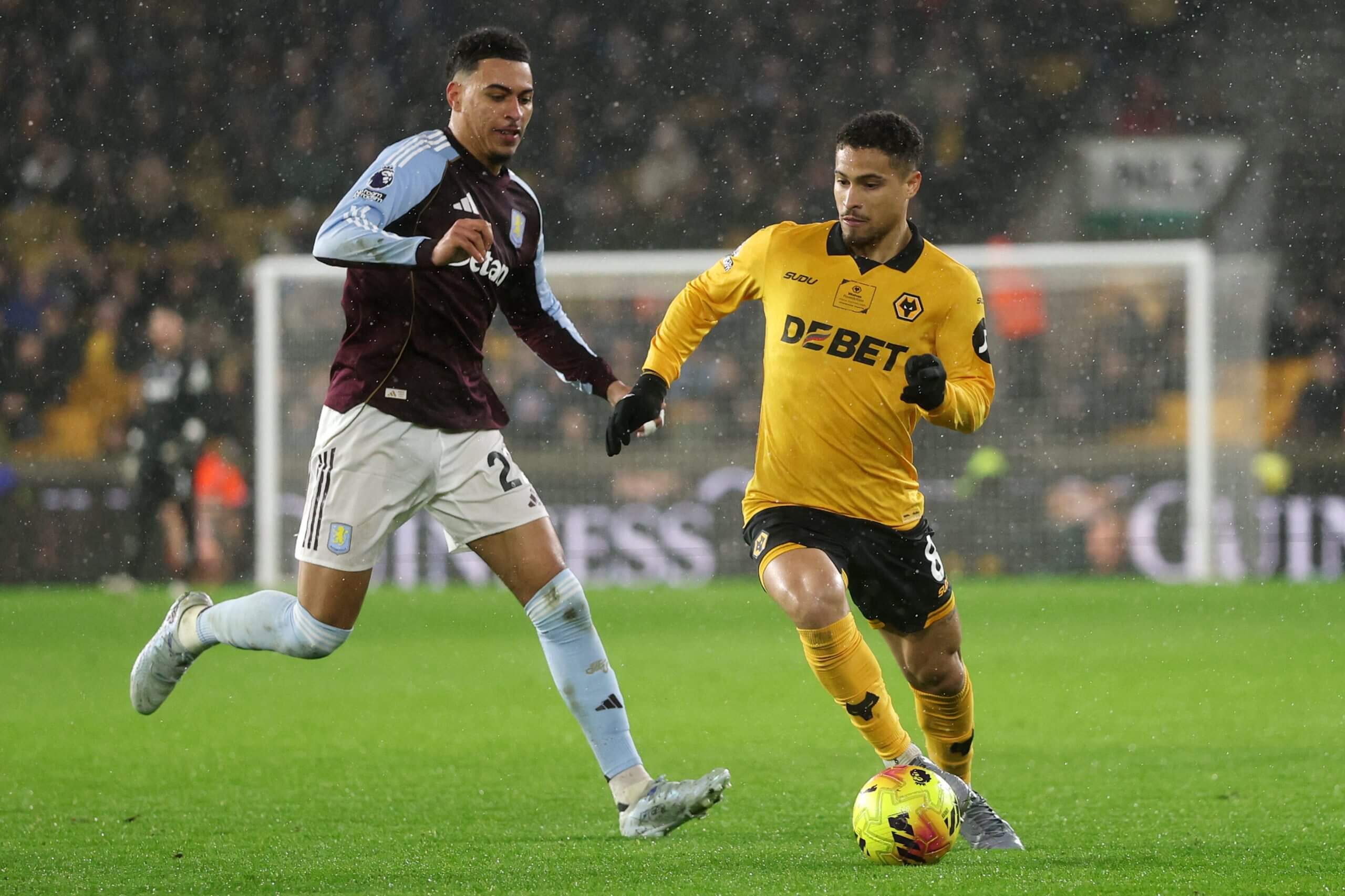 Morgan Rogers moves in to challenge Wolves' Joao Gomes