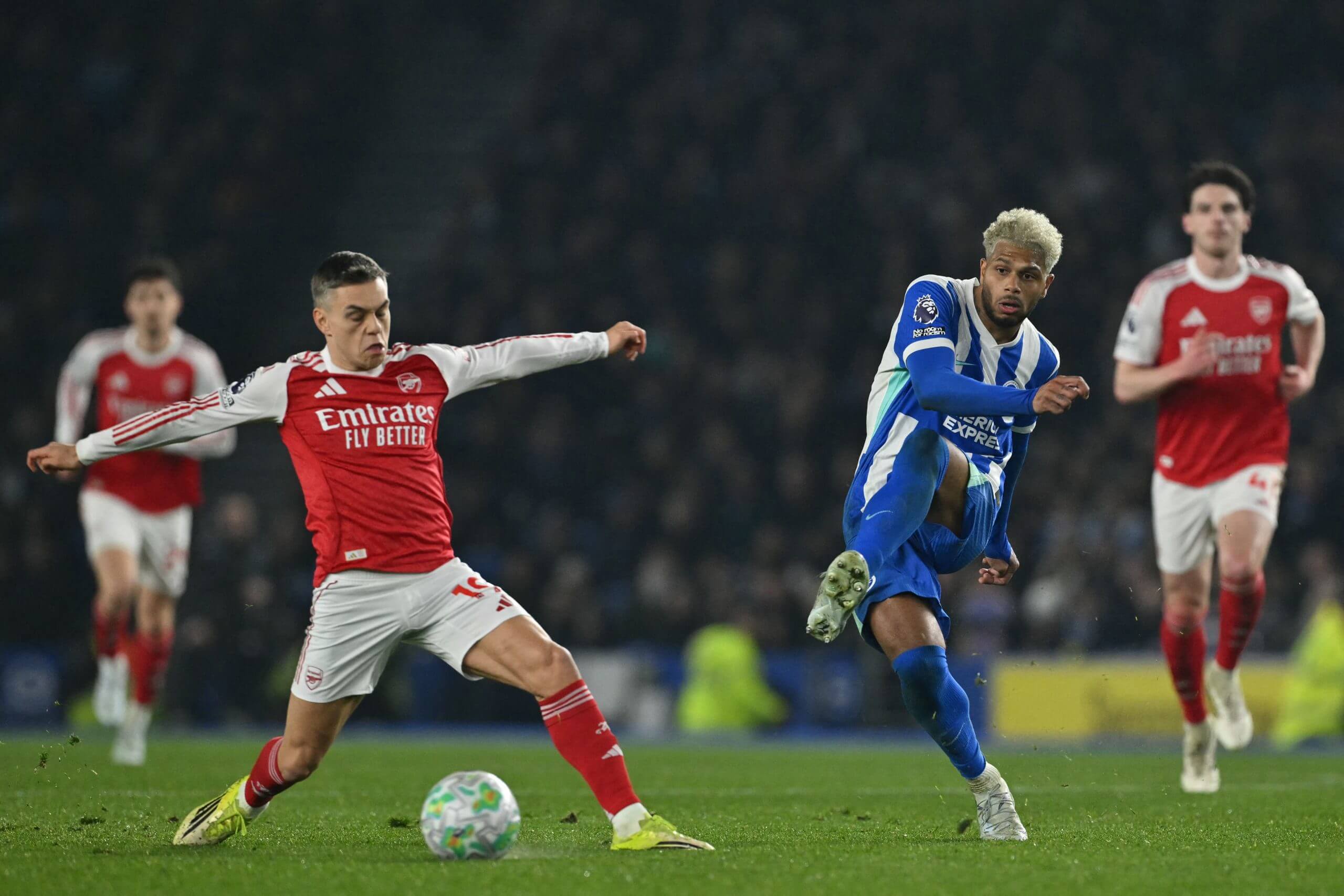 Leandro Trossard attempts to block Georginio Rutter's shot during the match between Brighton and Arsenal