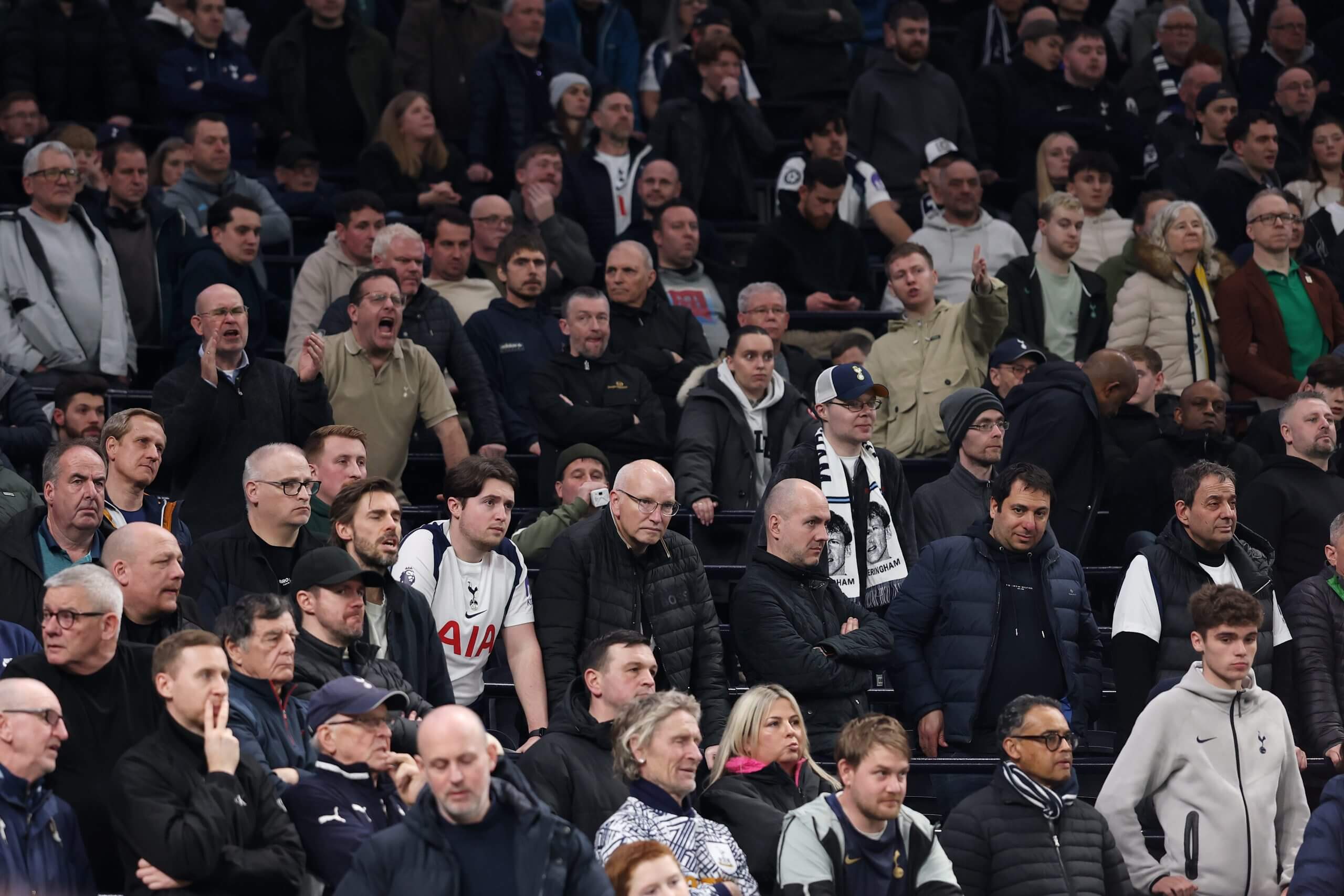 Fans of Tottenham Hotspur react as they watch on during the Premier League match against Crystal Palace