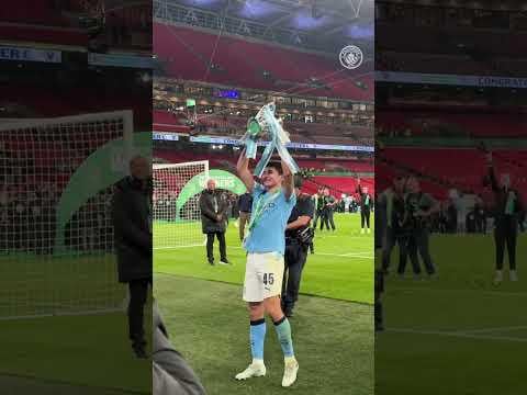 Khusanov lifting the trophy in the most Khusanov way possible