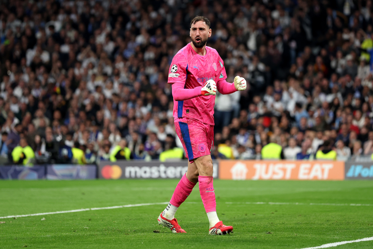 MADRID, SPAIN - MARCH 11: Gianluigi Donnarumma of Manchester City celebrates after saving a penalty by Vinicius Junior of Real Madrid (not pictured) during the UEFA Champions League 2025/26 Round of 16 First Leg match between Real Madrid CF and Manchester City FC at Estadio Santiago Bernabeu on March 11, 2026 in Madrid, Spain. (Photo by Florencia Tan Jun/Getty Images)