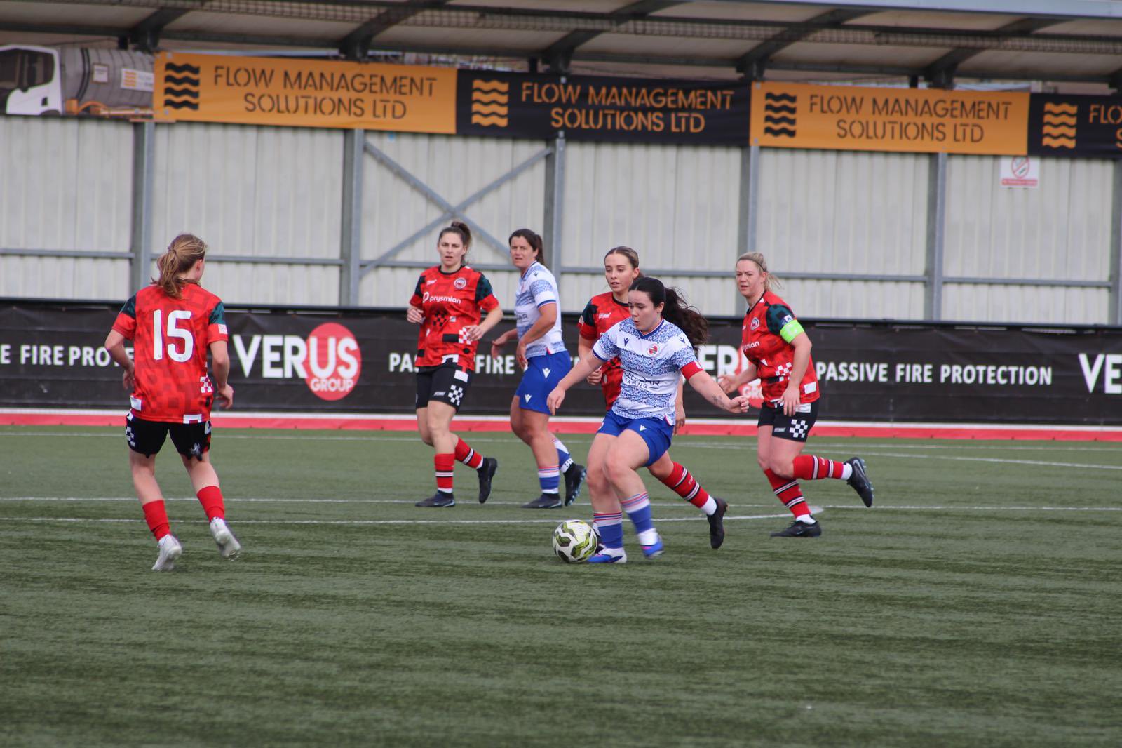 Reading captain Mia Parker in possession as Nat Cowell watches on