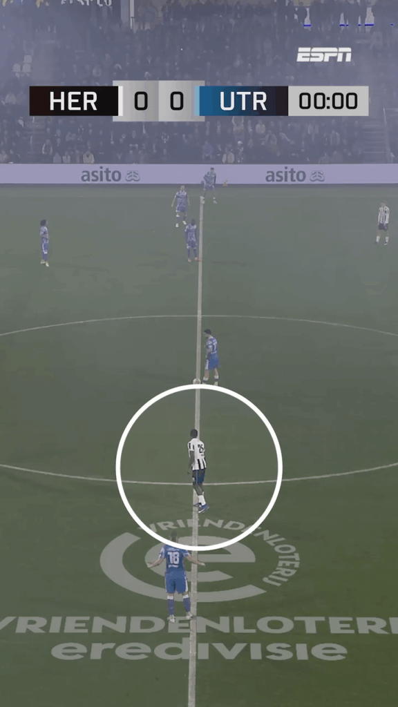 Heracles' Lequencio Zeefuik lets the opponent know he's there a second after kickoff