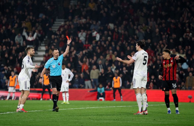 Soccer Football - Premier League - AFC Bournemouth v Manchester United - Vitality Stadium, Bournemouth, Britain - March 20, 2026 Manchester United's Harry Maguire is shown a red card by referee Stuart Attwell REUTERS/Hannah Mckay EDITORIAL USE ONLY. NO USE WITH UNAUTHORIZED AUDIO, VIDEO, DATA, FIXTURE LISTS, CLUB/LEAGUE LOGOS OR 'LIVE' SERVICES. ONLINE IN-MATCH USE LIMITED TO 120 IMAGES, NO VIDEO EMULATION. NO USE IN BETTING, GAMES OR SINGLE CLUB/LEAGUE/PLAYER PUBLICATIONS. PLEASE CONTACT YOUR ACCOUNT REPRESENTATIVE FOR FURTHER DETAILS..