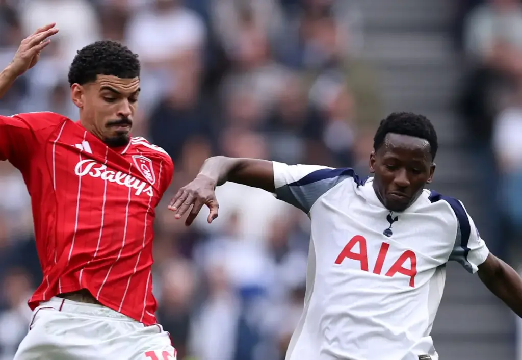 Nottingham Forest's Morgan Gibbs-White tackles Tottenham's Pape Matar Sarr