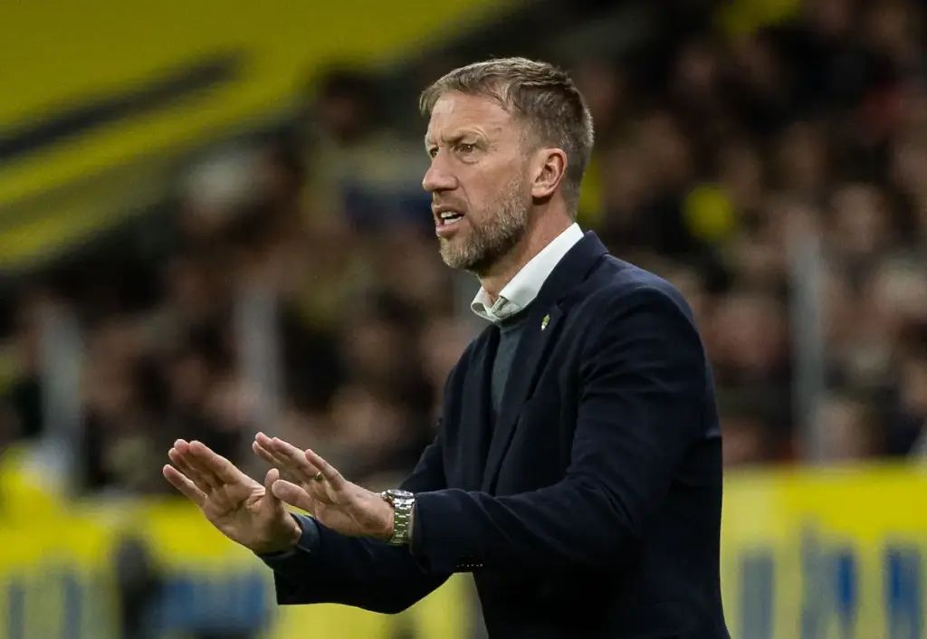 Graham Potter gestures with both hands to his Sweden players from the touchline