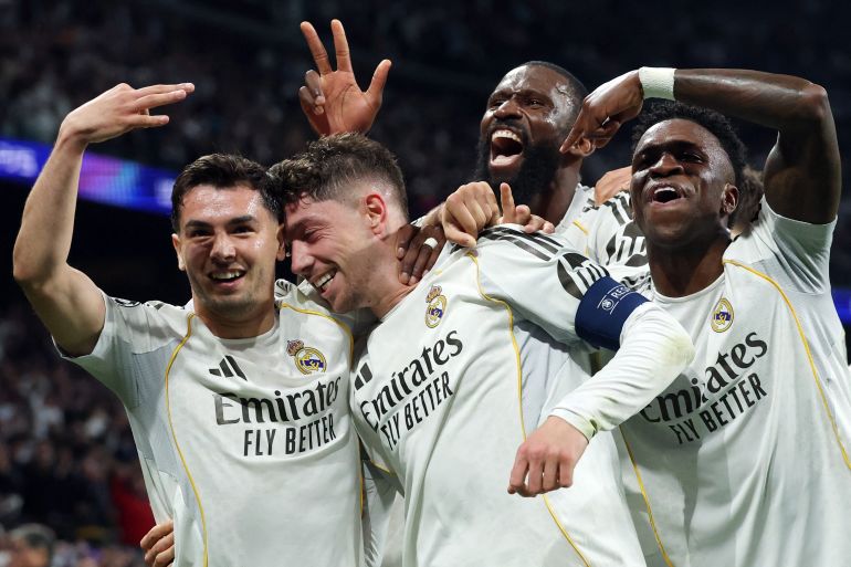 Real Madrid's Uruguayan midfielder #08 Federico Valverde (2L) celebrates his third goal during the UEFA Champions League last 16 first leg football match between Real Madrid CF and Manchester City at Santiago Bernabeu Stadium in Madrid on March 11, 2026.