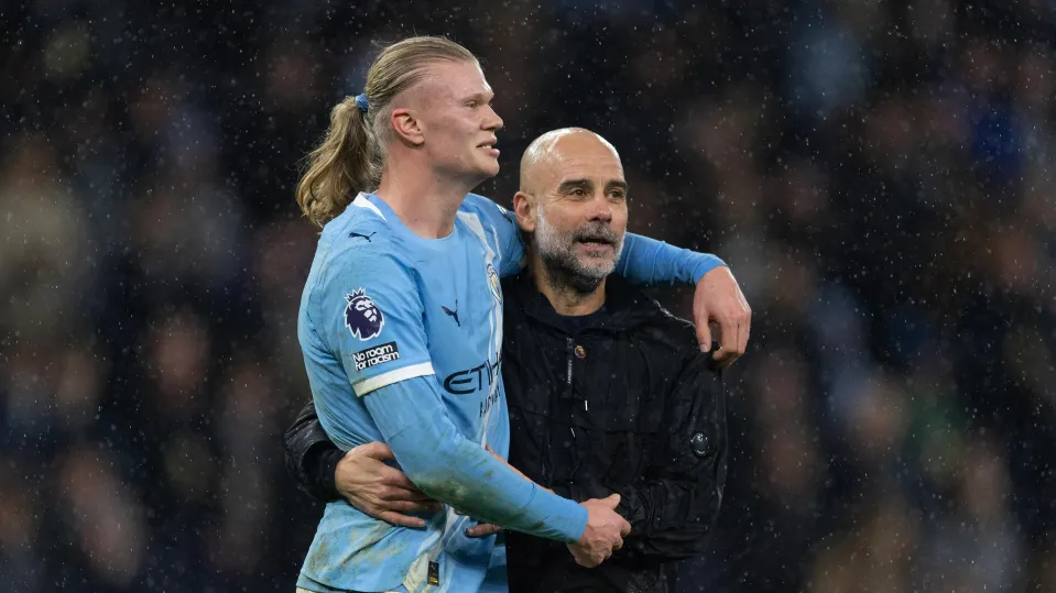 Erling Haaland hugs Pep Guardiola