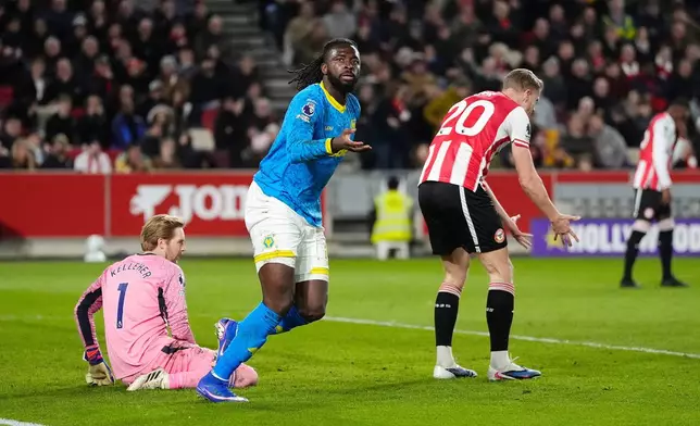 Wolverhampton Wanderers' Tolu Arokodare celebrates scoring during the English Premier League soccer match between Brentford and Wolverhampton Wanderers in London, Monday March 16, 2026. (John Walton/PA via AP)