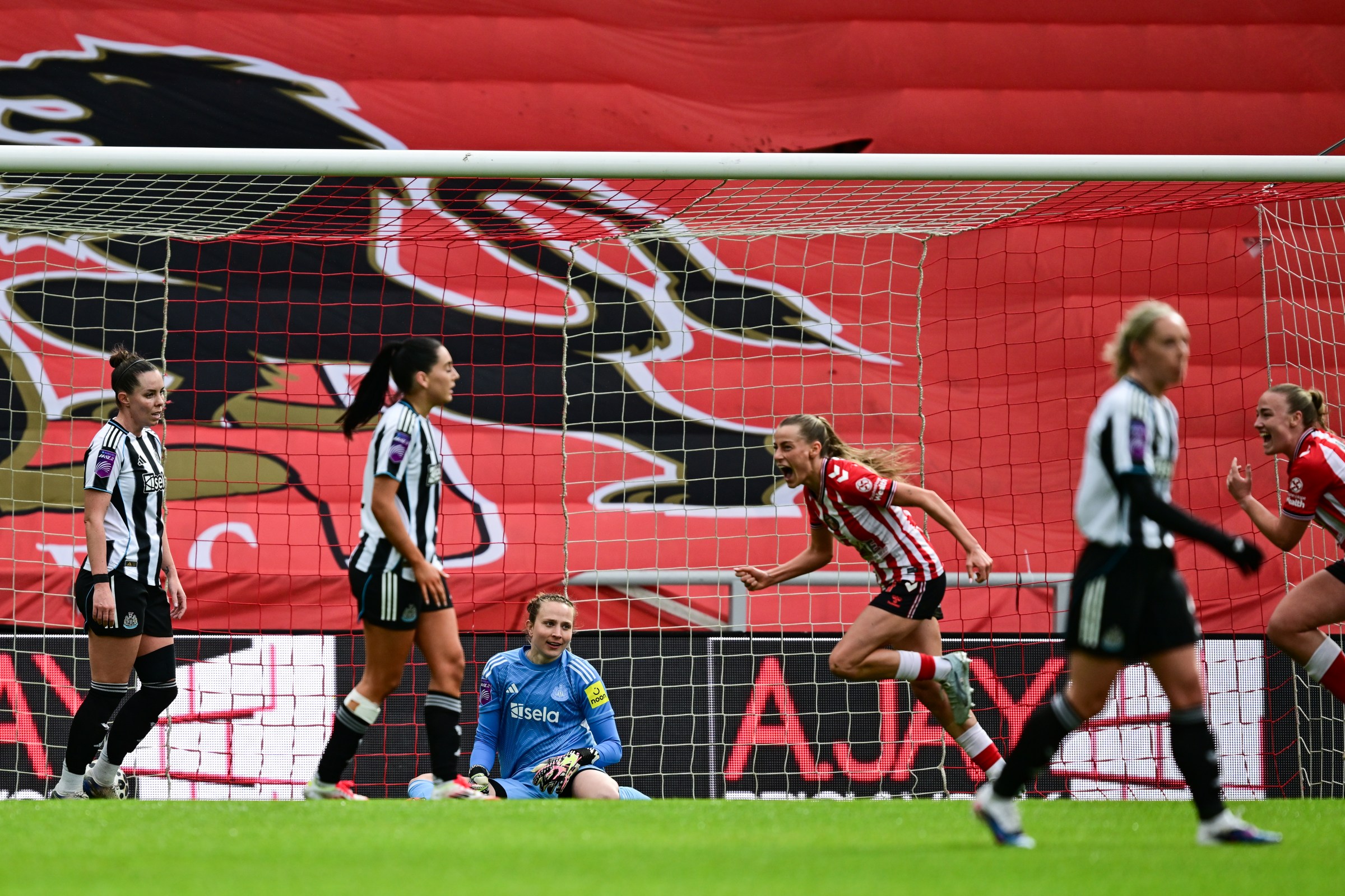 SUNDERLAND, ENGLAND - MARCH 29: Newcastle United Goalkeeper Anna Tamminen (1) looks on as Katy Watson of Sunderland (7) opens the scoring during the Barclays Women’s Super League 2 match between Sunderland and Newcastle United at Stadium of Light on March 29, 2026 in Sunderland, England. (Photo by Serena Taylor/Newcastle United via Getty Images)