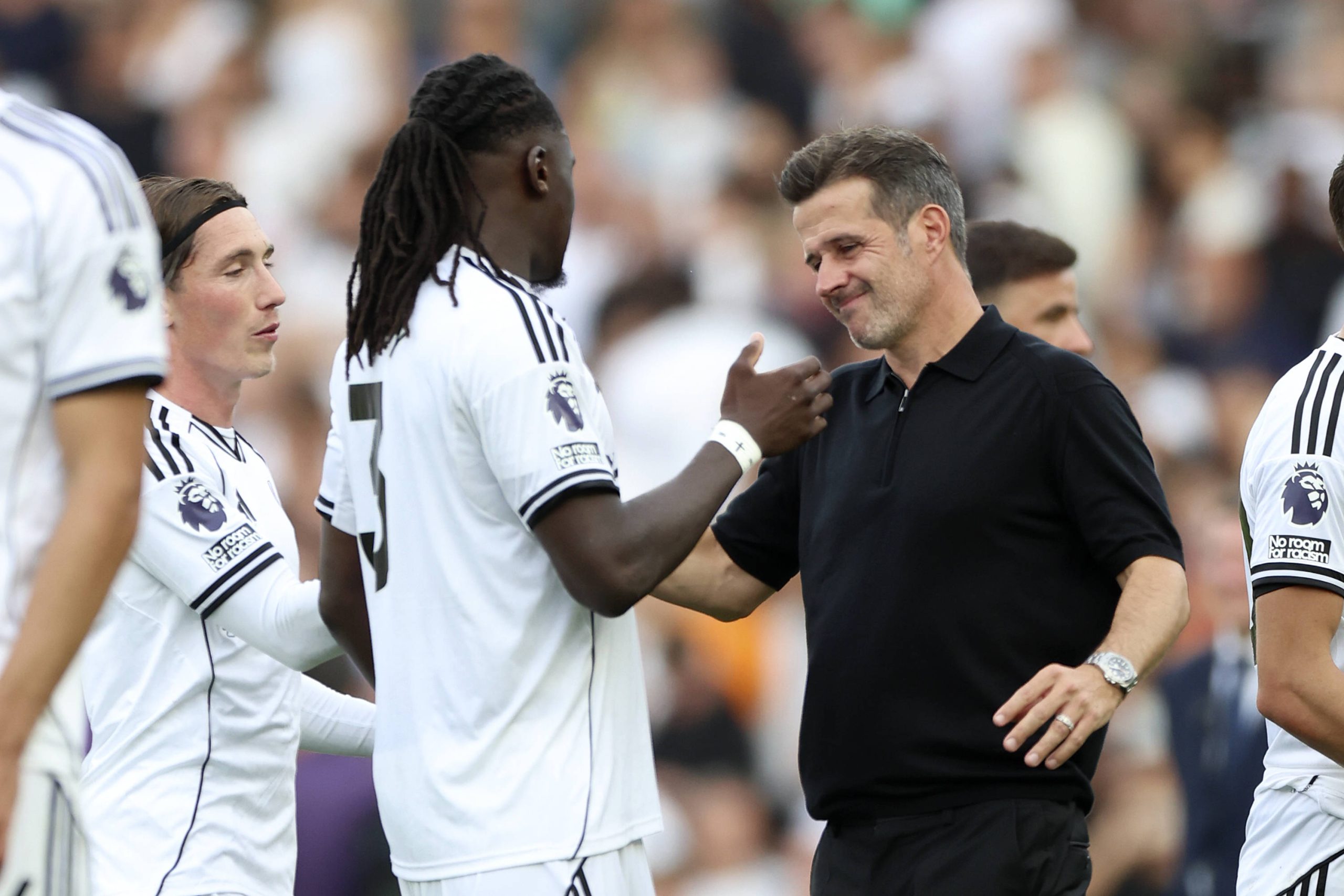 Calvin Bassey shakes hands with Marco Silva, after the Premier League match between Fulham and Manchester United at Craven Cottage