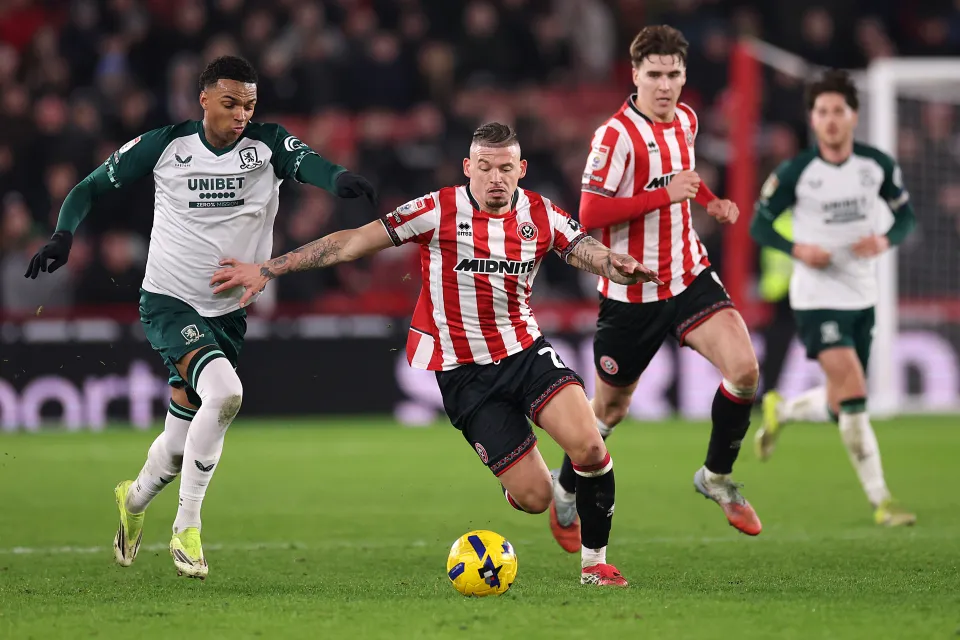 Kalvin Phillips of Sheffield United battles for possession with Morgan Whittaker of Middlesbrough during the Sky Bet Championship match between Sheffield United and Middlesbrough