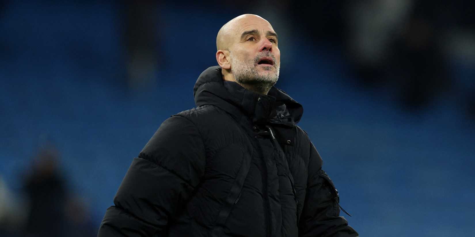 Manchester City manager Pep Guardiola looks to the sky