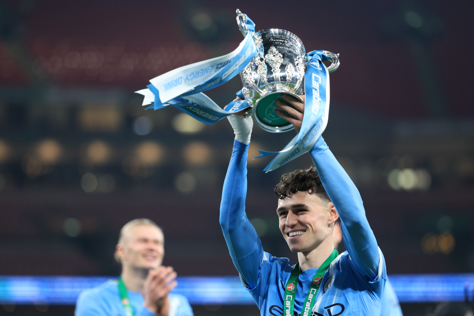 Phil Foden lifting the Carabao Cup