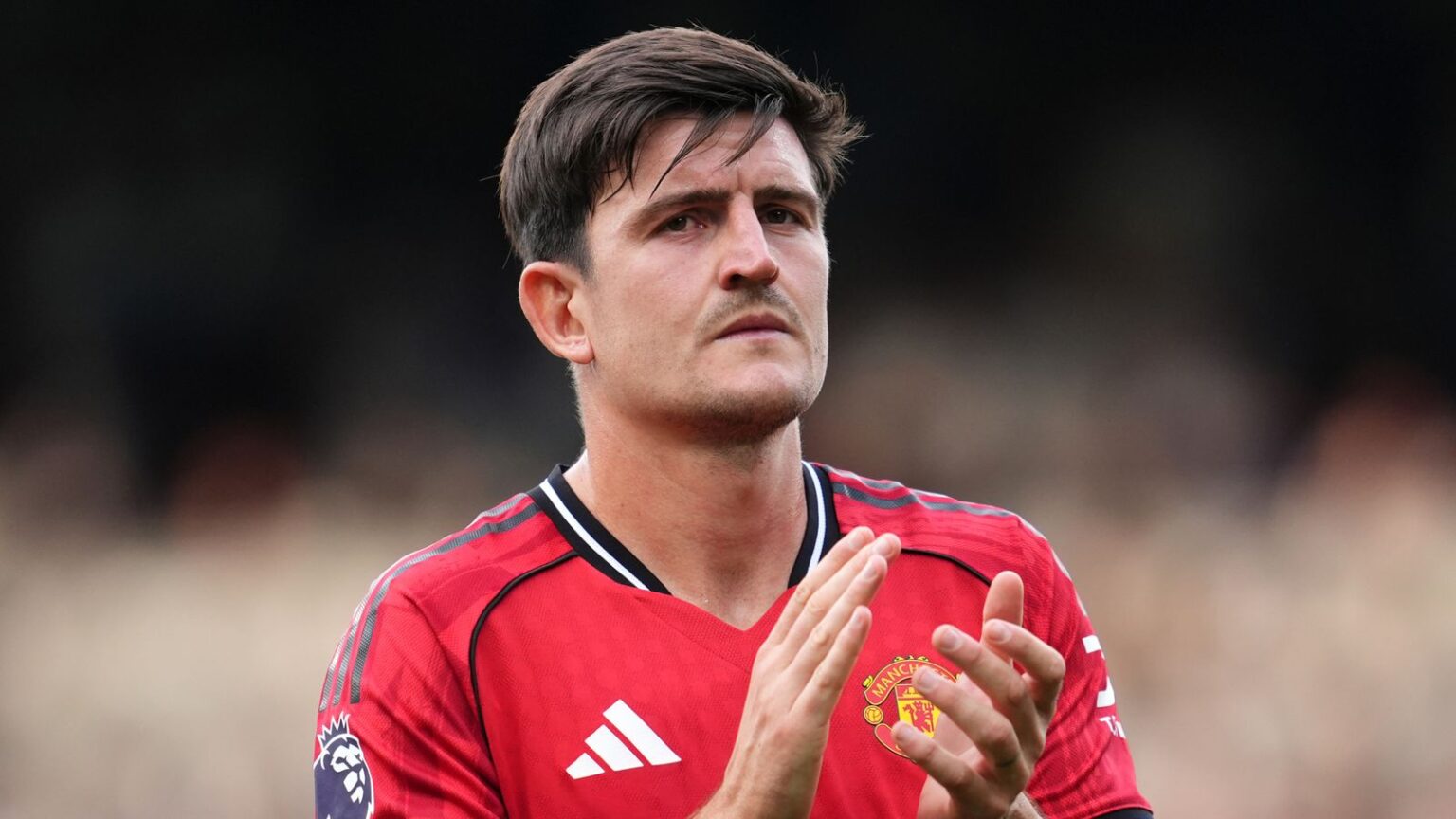 Manchester United's Harry Maguire applauds the fans following the Premier League match at Craven Cottage, London.