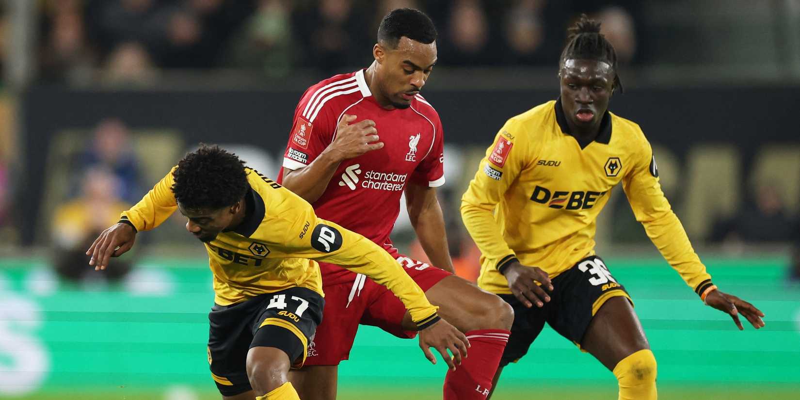 Wolverhampton Wanderers' Angel Gomes, Mateus Mane in action with Liverpool's Ryan Gravenberch