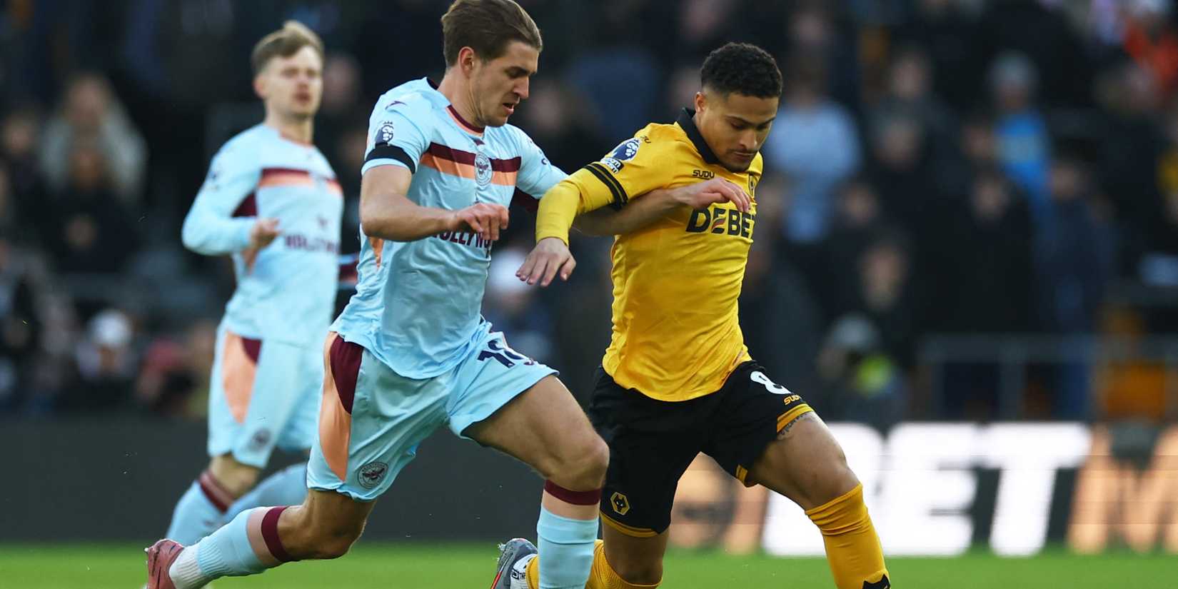 Wolverhampton Wanderers' Joao Gomes in action with Brentford's Yehor Yarmolyuk