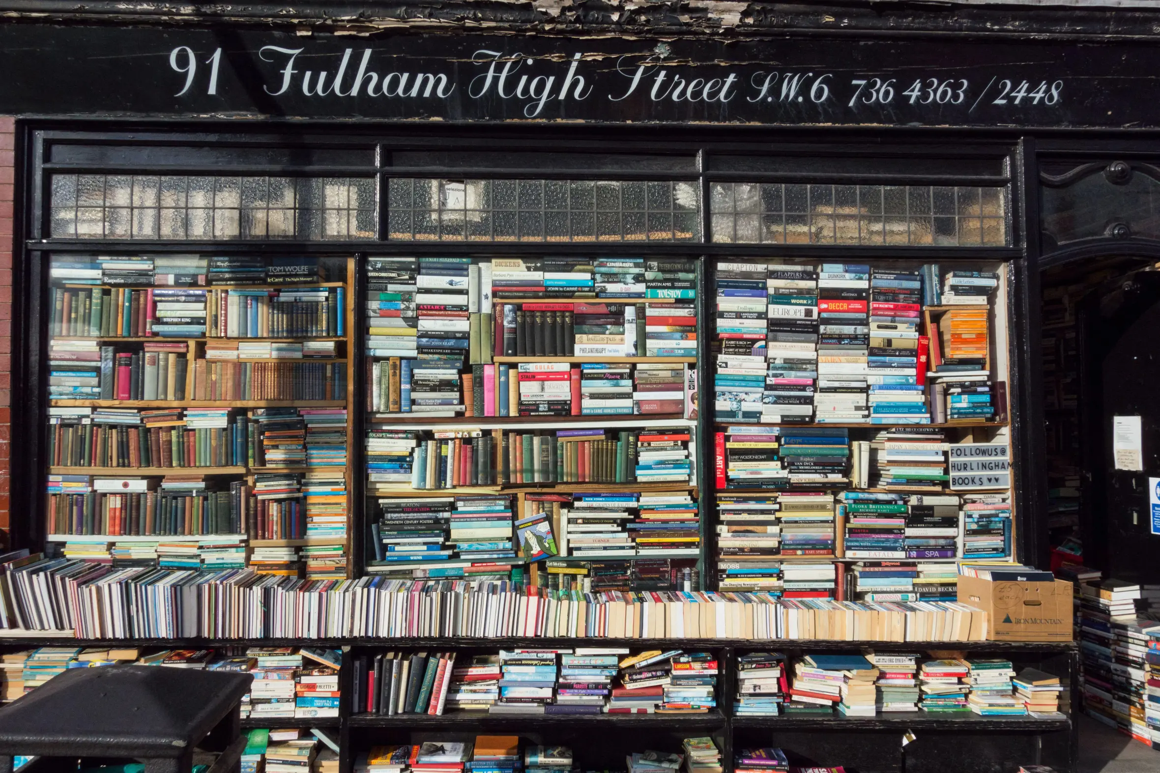 The storefront of Hurlingham Bookshop, with shelves of books visible through the window.