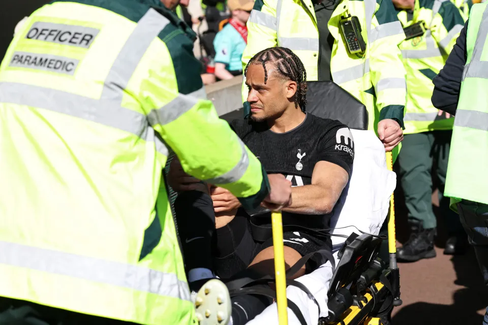 Xavi Simons taking off on a stretcher for Tottenham Hotspur.