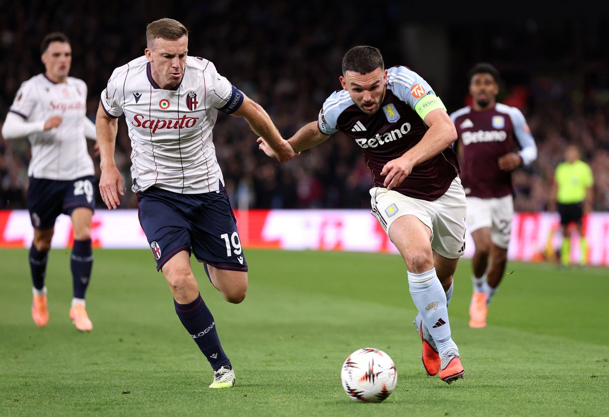 Lewis Ferguson of Bologna and Aston Villa's John McGinn