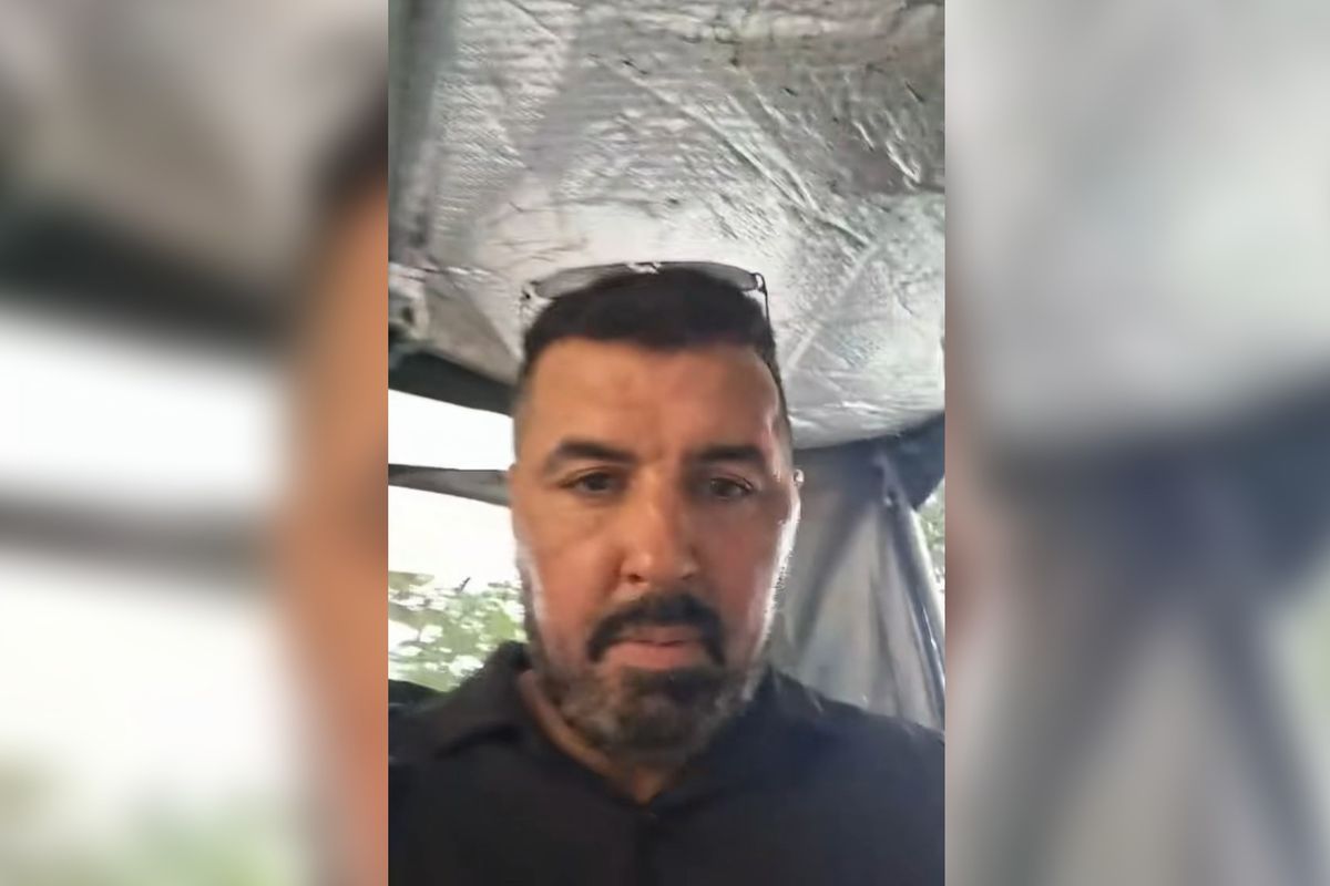 Sam Walker during a video he posted as he appeared to be placed in a police vehicle in Vietnam