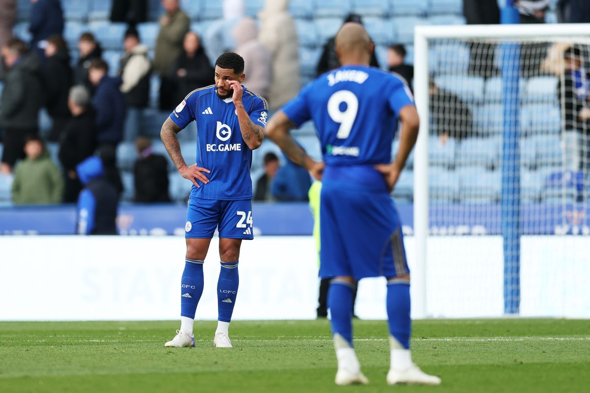 Jamaal Lascelles and Jordan Ayew look dejected after Leicester City's 1-0 defeat to Swansea