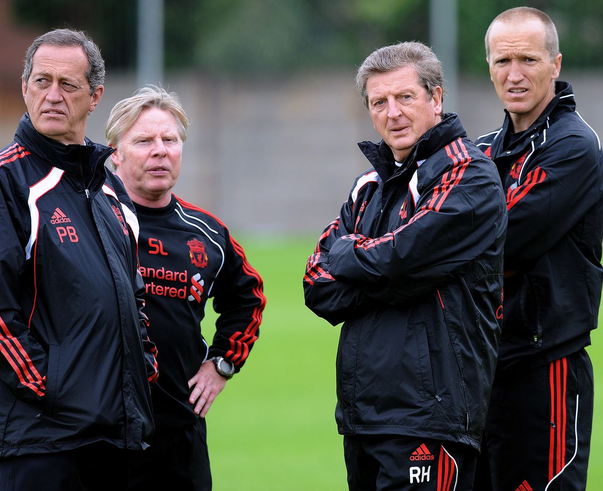 Roy Hodgson stands with Darren Burgess, Sammy Lee and Peter Brukner during a Liverpool training session